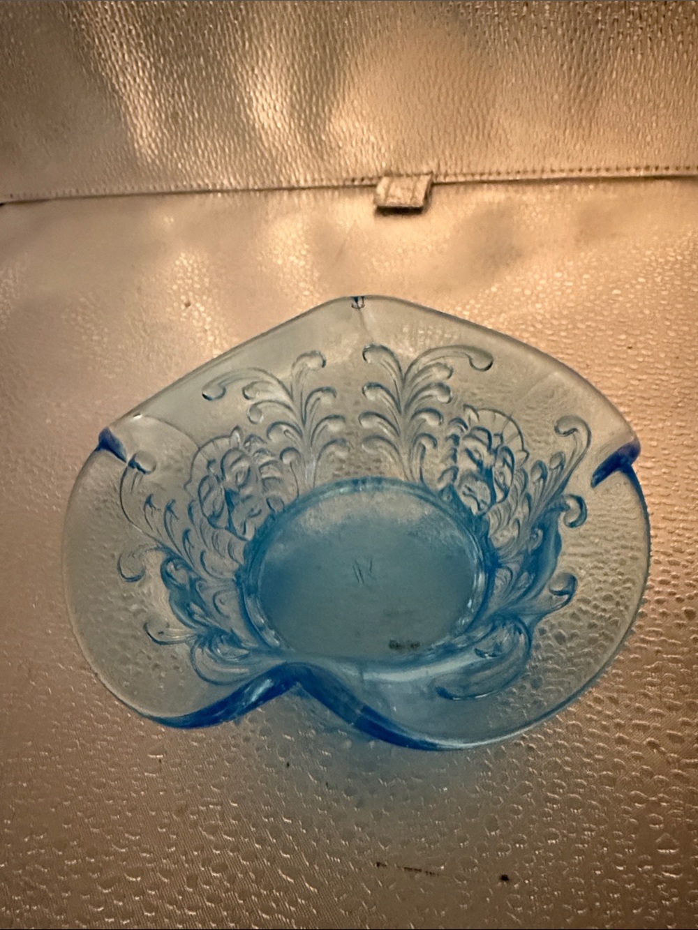 Vintage Pressed Blue Glass with embossed Lions and Scroll work.